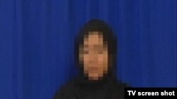 This unidentified woman, described as an arrested Tehran protester, was shown confessing to crimes on Iranian state television.