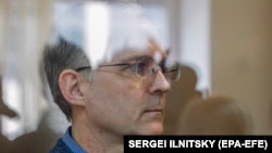 Paul Whelan stands inside a defendants' cage prior to a hearing of his lawyers' appeal against his arrest-term extension at the Moscow City Court in on September 17.