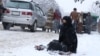 Kabul residents say the number of people begging in the city has soared in the past 18 months. (file photo)