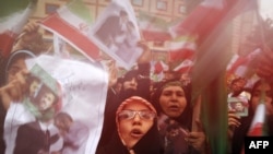 Supporters of Iranian President Mahmud Ahmadinejad celebrate his victory in Tehran on June 14. 