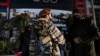 Afghan security personnel stand guard at the site of an alleged blast in the Dasht-e-Barchi neighborhood of Kabul on January 11. 