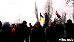 A screen grab from a live stream from Kharkiv at the scene after a deadly explosion at a "Dignity March" on February 22