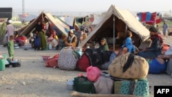 Afghan refugees rest in tents at a makeshift shelter camp in Chaman, a Pakistani border town abutting the southern Afghan province of Kandahar.