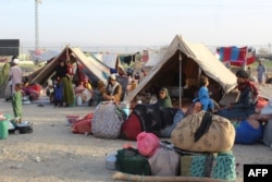 Afghan refugees rest in tents at a makeshift shelter camp in Chaman, a Pakistani town on the border with Afghanistan, on August 31, 2021.