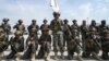 Members of the Taliban's Badri special forces take positions at the airport in Kabul on August 31.