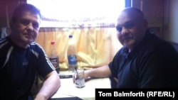 RFE/RL's Tom Balmforth joins two Berkut veterans on the train journey to Kyiv from Donetsk.