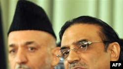 Zardari (right) and Karzai pledged to work together.