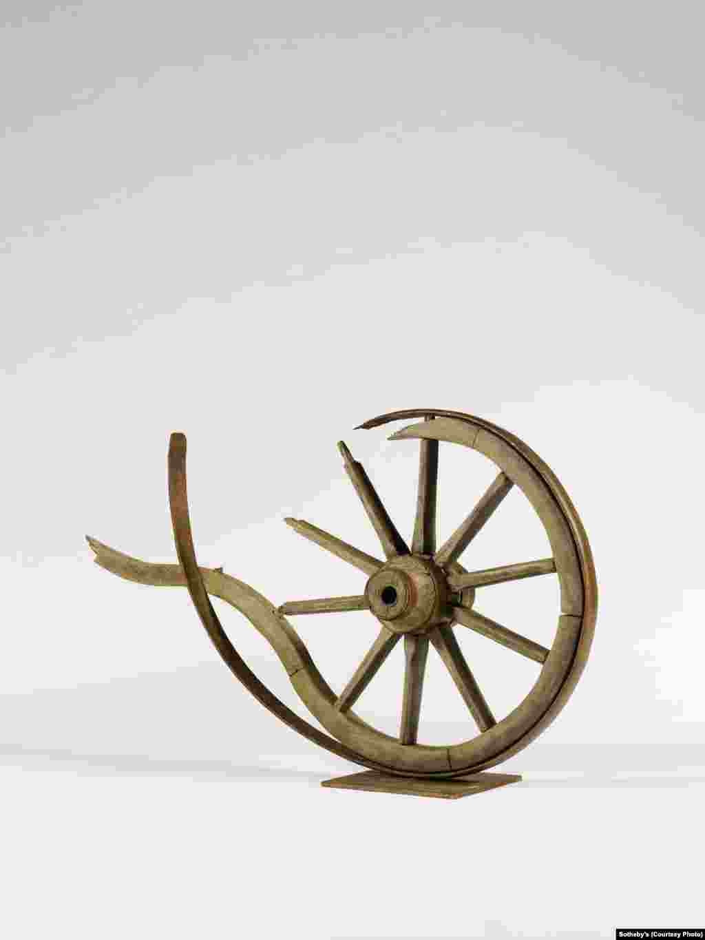 &ldquo;Disintegration,&rdquo; a 2012 wood and metal sculpture by Armenian artist Armen Gevorgyan (b. 1958). The broken wheel is symbolic of the Armenian people&rsquo;s long history of resettlement.