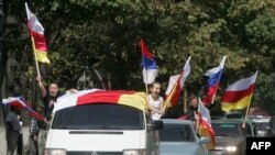 Tskhinvali residents celebrate the first anniversary of Russia's recognition of South Ossetia's independence.