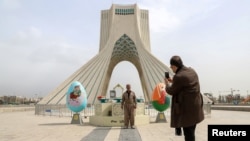 Norouz-themed decorations in Tehran. Millions of Iranians traveled this year to celebrate the Persian New Year, despite health guidelines warning them not to.