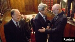 Afghan President Hamid Karzai (right) met with U.S. Secretary of State John Kerry (middle) and U.S. Ambassador to Afghanistan James Cunningham in Kabul on March 25.