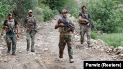 Members of the Afghan security forces on a foot patrol in Nangarhar Province before the Taliban takeover. (file photo)