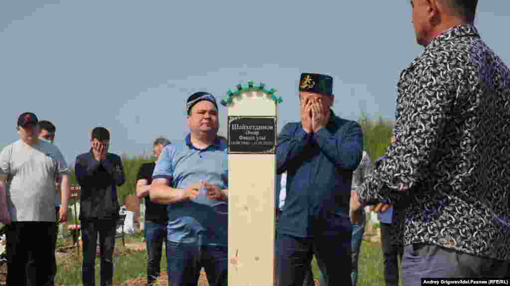 People attend the funeral of Amir Shaikhutdinov, 14, on May 12. Amir&#39;s classmates Ilzia Nagimullina and Damir Gaynutdinov were also buried.