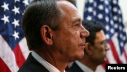 U.S. Speaker of the House John Boehner (left) and Rep Eric Cantor attend a news conference with Republican House members in Washington on October 10.