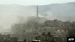 Syrian activists distributed this image showing smoke above buildings following an alleged toxic gas attack on August 21.