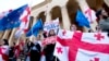 Protesters gather outside the parliament building in Tbilisi on April 15 to protest the country's "foreign-agent" law.