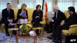 Iranian Deputy Foreign Minister Abbas Araghchi (right) attends a meeting with Foreign Minister Mohammed Javad Zarif (2nd-right) with EU foreign-policy chief Catherine Ashton (center) during talks over Iran's nuclear program in Geneva in November.