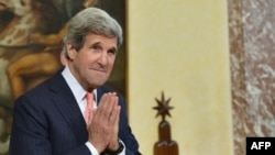 U.S. Secretary of State John Kerry gestures during a meeting in Italy on May 9, when he issued the warning about arming Syria with Russian missiles.