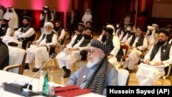 The Taliban delegation attends the opening session of peace talks between the Afghan government and the Taliban in Doha on September 12, 2020.