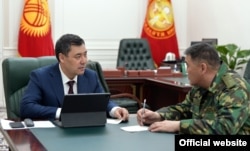 Kyrgyz President Sadyr Japarov (left) with Kamchybek Tashiev, the head of the State Committee for National Security.