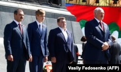 Alyaksandr Lukashenka (right) with his sons (left to right) Viktar, Mikalay, and Dzmitry attend a ceremony marking victory in World War II in Minsk in May 2018.