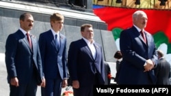 Alyaksandr Lukashenka (right) with his sons (left to right) Viktar, Mikalay, and Dzmitry attend a wreath-laying ceremony marking the anniversary of the victory over Nazi Germany in World War II in Minsk on May 9.