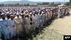 Supporters and local residents offer funeral prayers for provincial lawmaker Farid Khan, who was killed in an attack by Taliban gunmen, in Hangu in Khyber Pakhtunkhwa Province on June 4.