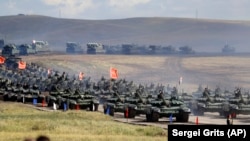 Chinese tanks roll about 250 kilometers southeast of the Russian city of Chita during the military exercises Vostok 2018 in September 2018.