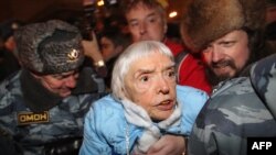 Russian riot police arrest Lyudmila Alekseyeva at a Moscow rally on December 31.