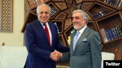 Afghan Chief Executive Officer Abdullah Abdullah (right) meets with Zalmay Khalilzad, the U.S. envoy seeking a peace deal with the Taliban, in Kabul on April 3.