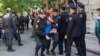 Azerbaijani police arrest protesters following the jailing of youth activists in Baku on May 6.