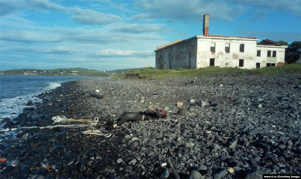 The body of a man discovered with the vessel. Journalist Aleksandr Krestov, from local media outlet VL.ru, told RFE/RL the body was still on the beach late on August 31, with police claiming it was the responsibility of local morticians to remove it.