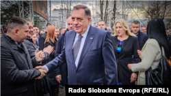 The president of Bosnian entity Republic of Srpska, Milod Dodik, greets supporters in Banja Luka after his sentence in Sarajevo on February 26.