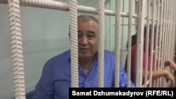 Omurbek Tekebaev in a cell during a court hearing