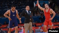 "No matter how much they say that there will be equal conditions, it is one thing to say it and another thing to do it," says Armenian wrestler Arsen Julfalakian (right), an Olympic silver medalist.