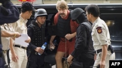 Alleged Russian arms dealer Viktor Bout arrives at his hearing at the Criminal Court in Bangkok.