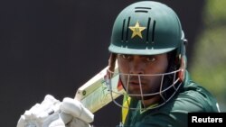 Pakistani Umar Akmal prepares to play a shot during a practice session before a match against New Zealand on March 7