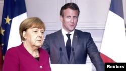 German Chancellor Angela Merkel (left) and French President Emmanuel Macron (file photo)