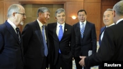 Turkish President Abdullah Gul (third from left) with other participants in a summit of Turkic-speaking countries outside Bishkek on August 23, before his sudden departure.