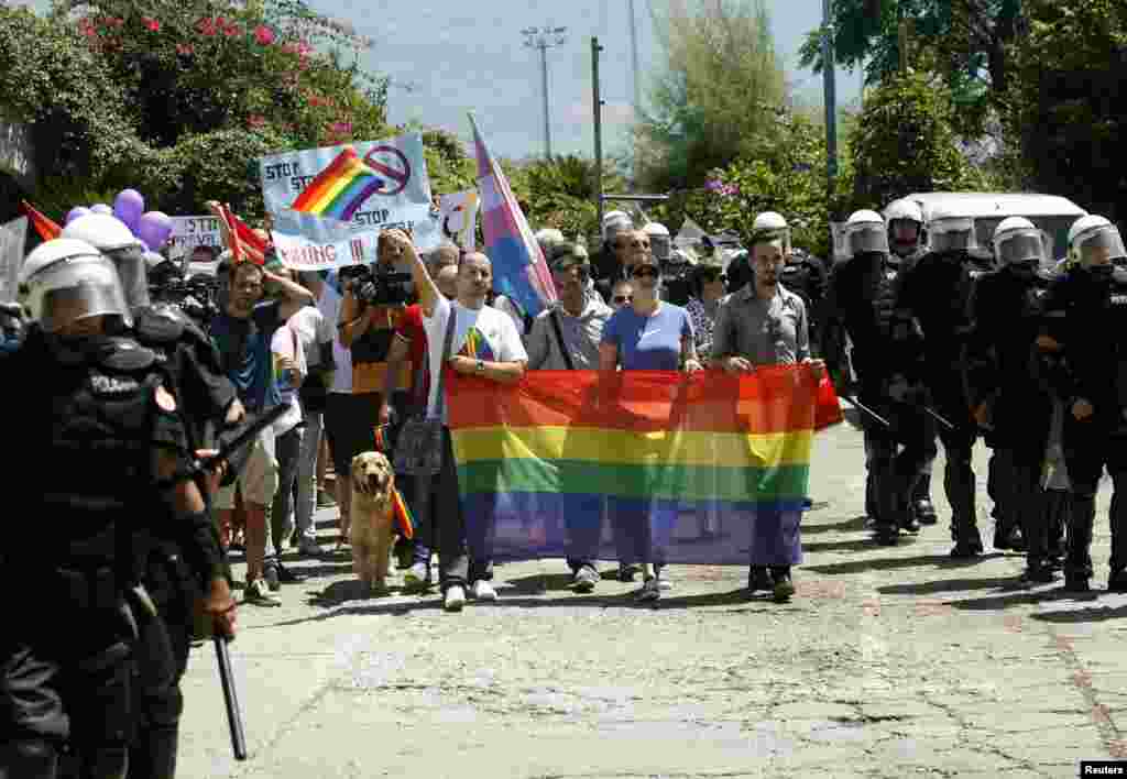 Montenegrin riot police accompany activists during a gay-pride parade in Budva on July 24.