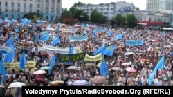 People gather for the day of mourning for victims of the deportations in the Crimea in Simferopol on May 18.