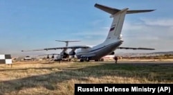 Russian military planes with peacekeepers on board are seen after landing at Erebuni Airport outside Yerevan on November 10.