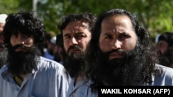 Taliban prisoners are released from an Afghan prison late last month as part of a U.S.-Taliban deal to achieve peace in the war-torn country. Progress on the agreement has stalled recently and now there are reports of possible divisions within the Taliban's ranks. 