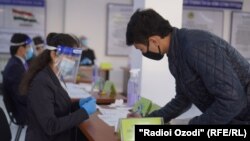 A man in Dushanbe casts his ballot in the country's presidential election on October 11.