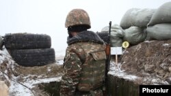 An Armenian soldier on combat duty on the border with Azerbaijan (file photo)