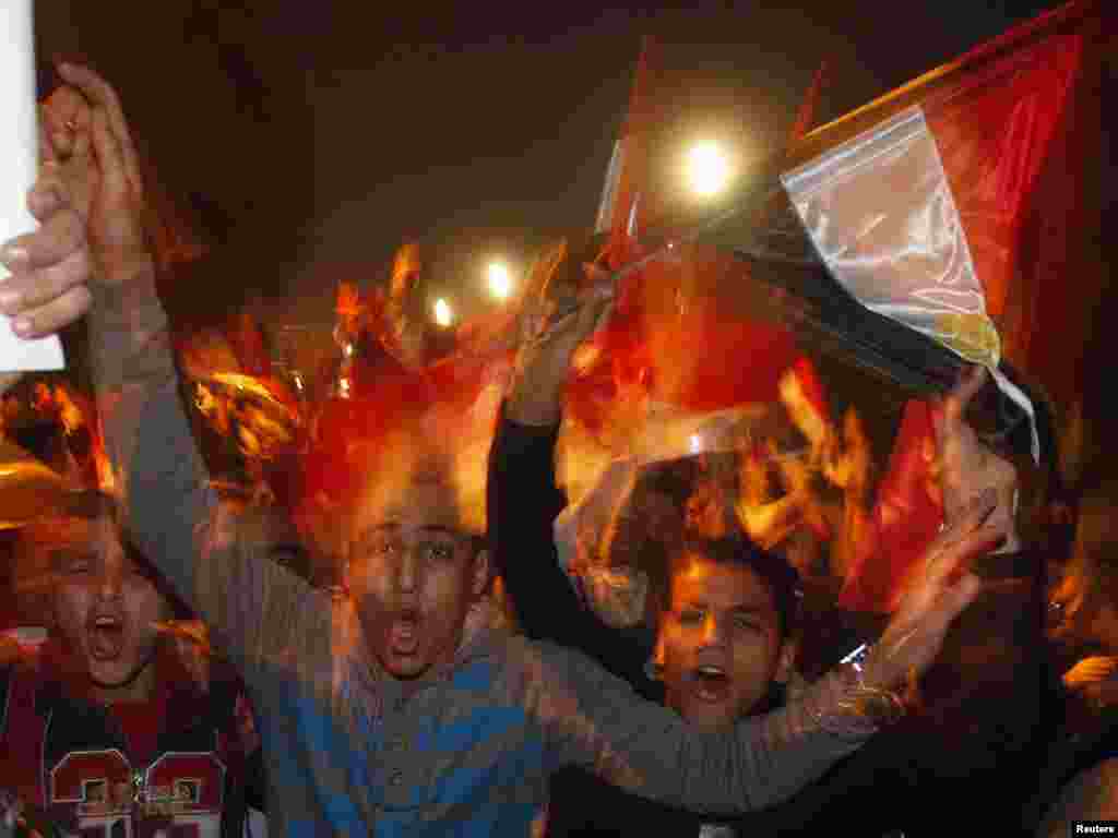 Opposition protesters celebrate Mubarak's resignation on Tahrir Square in Cairo on February 11.