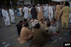 Union workers gather during a protest against the International Monetary Fund and government policies in Islamabad on October 14, 2020.