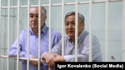 Omurbek Tekebaev (left) and Duishonkul Chotonov say the charges are politically motivated.