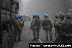 Kazakh troops are seen wearing UN helmets in Almaty on January 6.