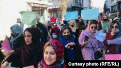 Afghan women protest on January 11 against the Taliban's decree of mandatory hijab.